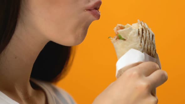 Woman Greedily Eating Pita Burger, Bulimia Problems, Unhealthy Fast Food Meal