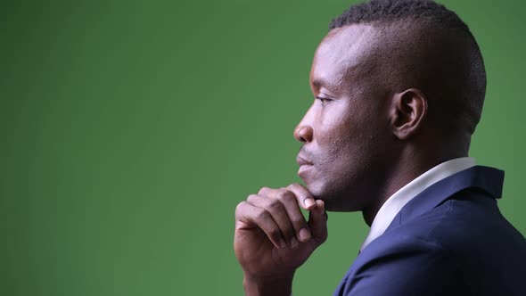 Profile View of Young African Businessman Thinking