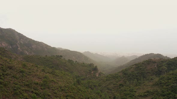 Drone Flight Over Misty Hills And Mountains