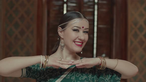 Portrait of Playful Winking Woman in Indian Sari