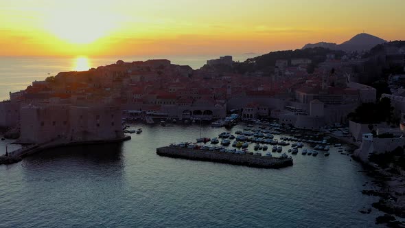  Dubrovnik Old Town, city walls and harbor at sunset 