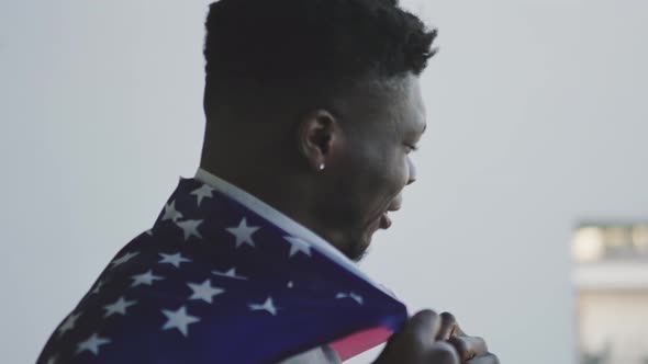 Black Man African-american with USA Flag Covering His Shoulders