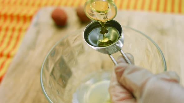 Pour a Tablespoon of Olive Oil Into a Clear Bowl