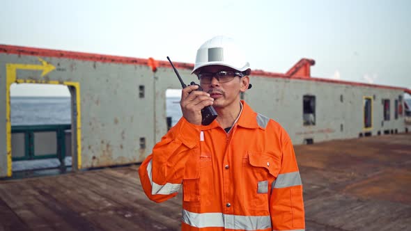 Filipino Deck Officer on Deck of Vessel or Ship , Wearing PPE Personal Protective Equipment