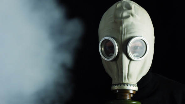 Man In A Gas Mask And Smoke