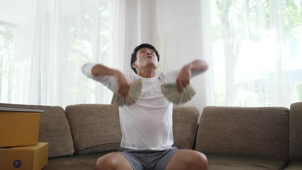 Slow Motion Portrait of Very Happy Successful Cheering Man Throwing Money Up