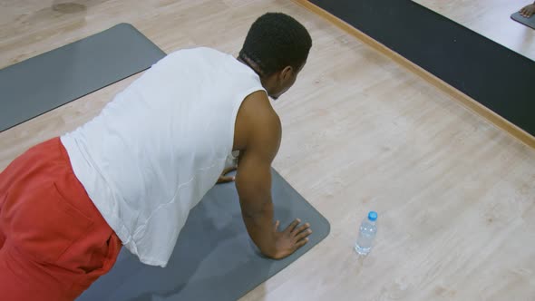 Sport Man Doing Plank Exercise Fitness Workout at Gym