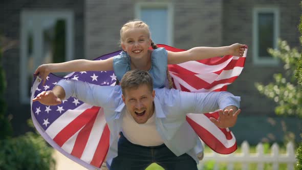 Father and Daughter Fooling Around, Girl Waving USA Flag, Independence Day