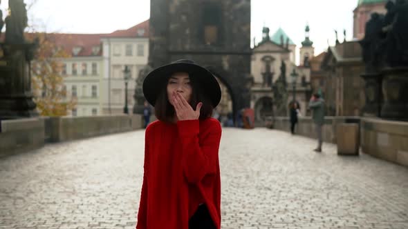 Happy Asian Woman Tourist Walking on Charles Bridge in Prague