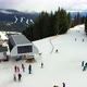View from the mountain to the ski lift and people who ski and snowboard. - VideoHive Item for Sale