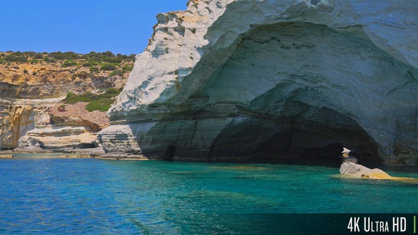 4K White rock formations and sea caves at Kleftiko shoreline, Milos, Greece