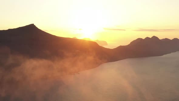 Drone At Sunrise Over Mountains And Coastline