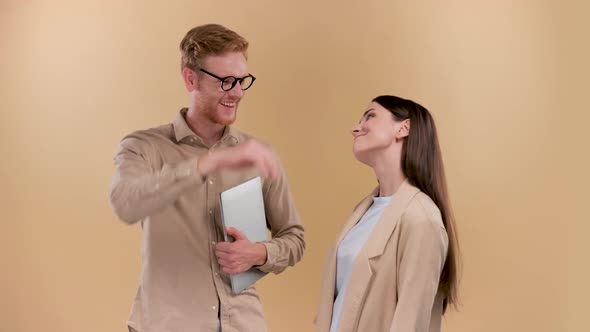 Success Positive Outcome Two Colleagues Over the Beige Background Giving Each Ither High Five