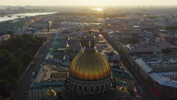 Golden Dome of Isaac Cathedral at Sunrise Aerial Morning Cityscape with Warship in the Neva River