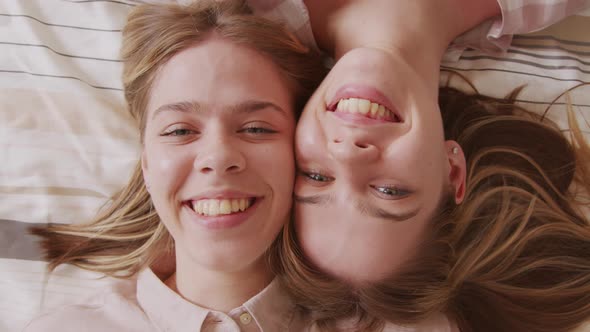 Top View of Happy Twin Girls