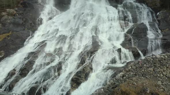 Close Up View of the Famous Furebergfossen Waterfall in Norway, Sliding Drone Shot