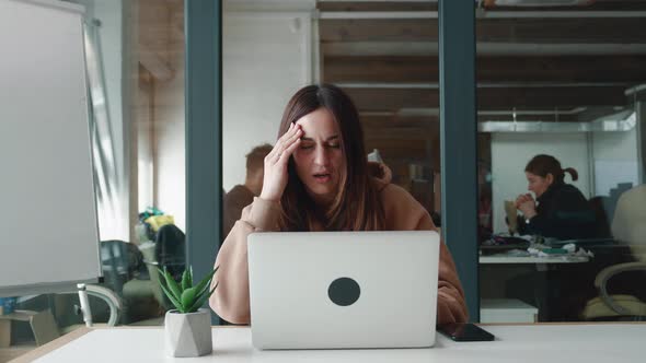 Woman in a Sweatshirt Tired Big Problems at Work Going Through Experiencing Stress Sudden Pain in