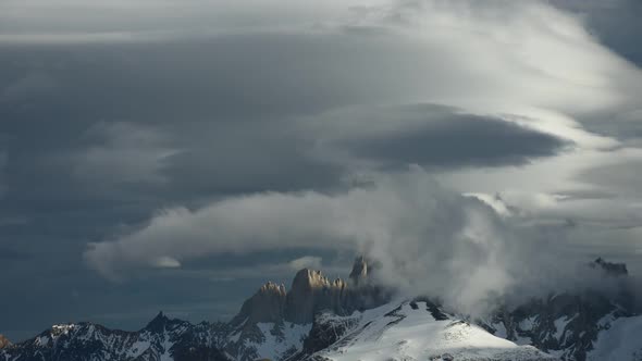 Time lapse of clouds swirling around jagged peaks in Patagonia, South America