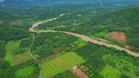 4K : Aerial view over farmland and hill farming