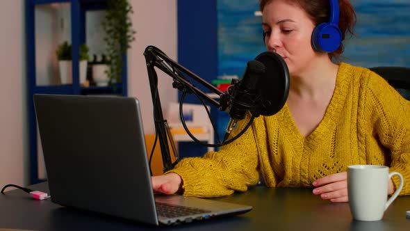 Woman Podcaster Recording Audio Podcast on Laptop Computer