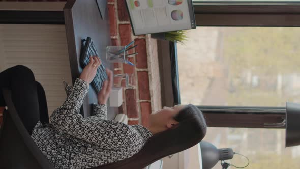 Vertical Video Employee Working with Business Charts Design on Computer