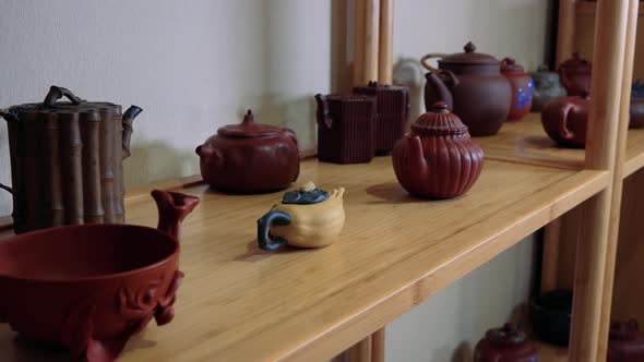 Closeup on Ceramic Dishes on a Shelf