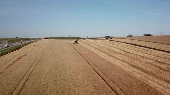 Aerial View of Combine Harvesters Agricultural Machinery. The Machine for Harvesting Grain Crops.