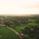 4K Aerial footage of rice field with palm trees and rural at sunrise.  - VideoHive Item for Sale