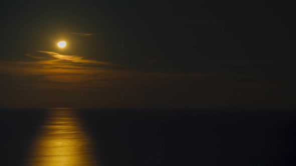Time lapse shot of moonset in Black sea, Batumi, Georgia