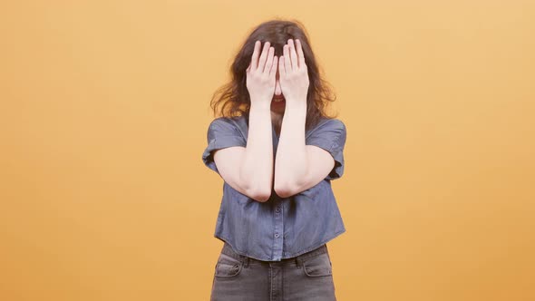 Young Woman Makes Different Expressions and Hides Her Face