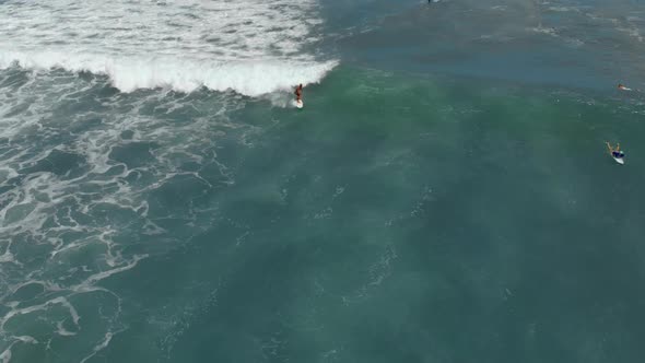 Aerial Shot of a Surfer Riding on a Wave