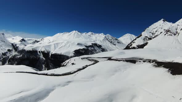 Aerial view of beautiful snowy mountains in Gudauri, Georgia