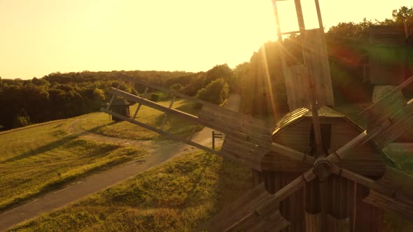 Rural Landscape with Windmills and Bright Evening Sunshine