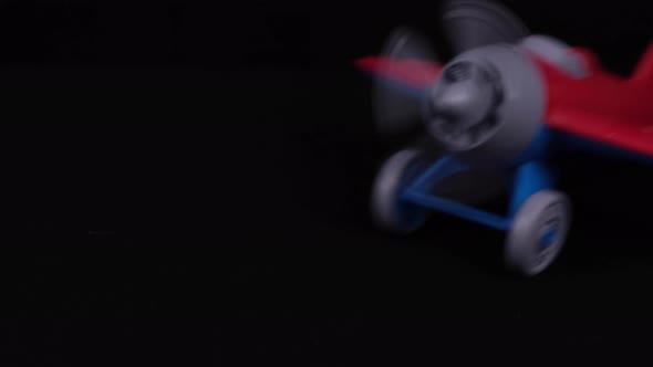 The Propeller Of The Wheeled Toy Airplane Is Spinning