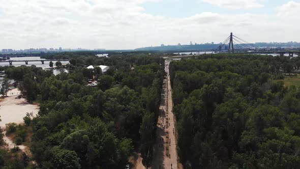 Park with group of cyclists and beautiful nature around