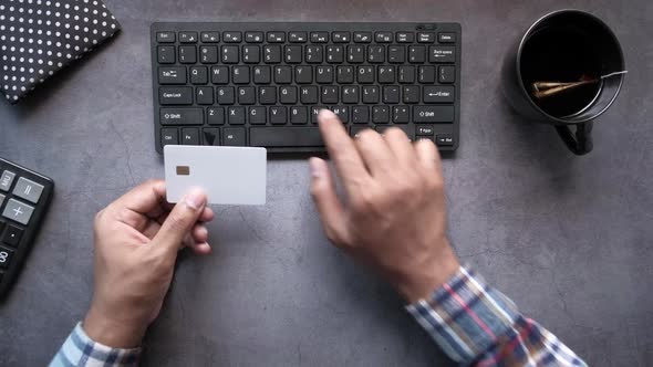 Man Hands Holding Credit Card and Using Laptop Shopping Online