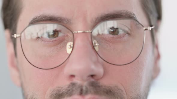 Close Up of Blinking Eyes of Young Man