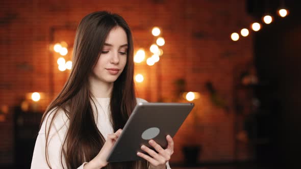 A Woman is Sitting in Her Home Office