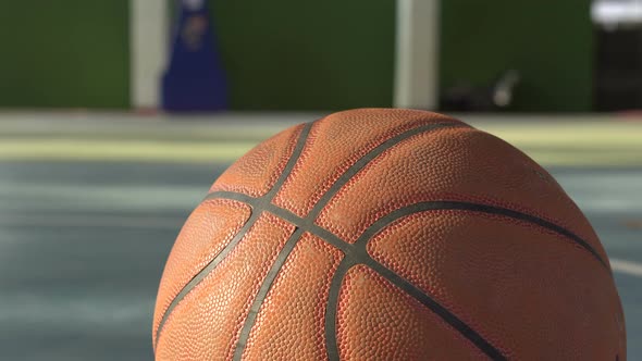 Leather skin basketball close up shot with blur court