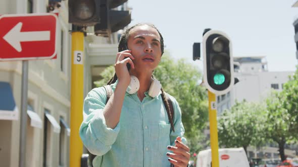 Mixed race man talking on the phone