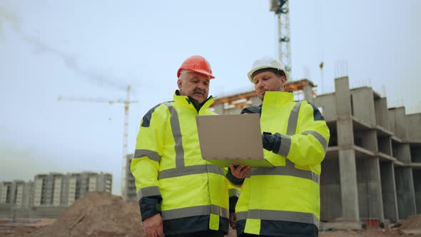 Building Inspector and Civil Engineer are Viewing and Discussing New Object in Building Area