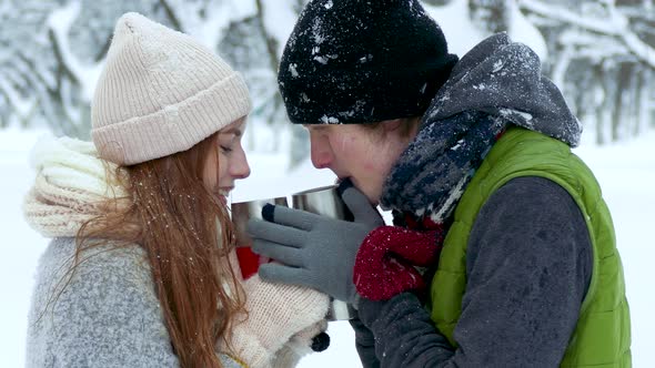 Couple Drinking Tea Coffee Cup in the Winter
