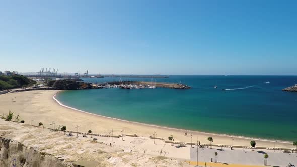 Upwards Pan Shot From Stone Wall Pointing at Ocean in Sines Portugal