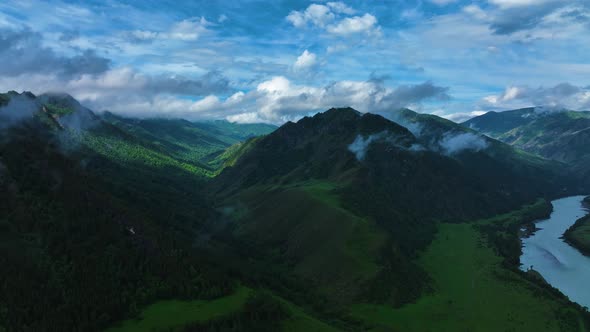 Landscape of mountains in summer. Fog. Aerial view