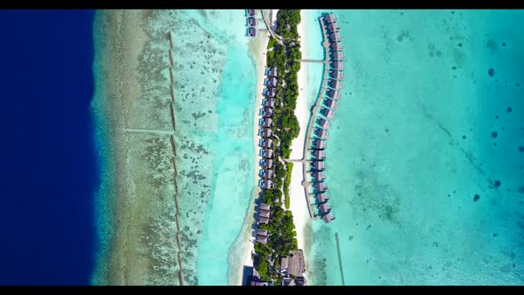 Aerial drone shot sky of tranquil bay beach voyage by clear sea and bright sand background of a dayo