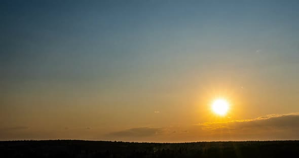 Beautiful Evening Sunset, Time Lapse, Movement of Clouds of a Different Level Against the Setting