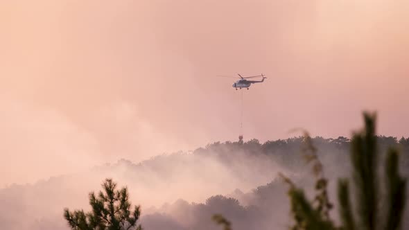 Fire Helicopter Is Flying Above Wildfire