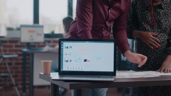 Close Up of Pregnant Woman and Man Planning Business Project