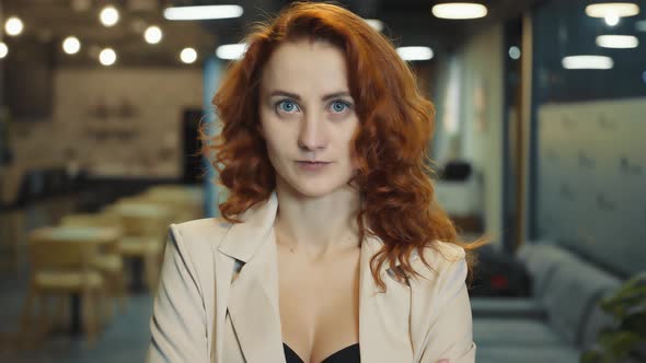 Face of a Woman of European Appearance with Red Hair Close Up