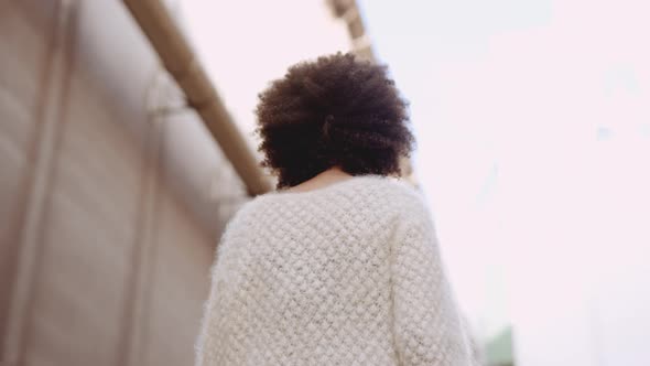Young Model In Woollen Fashion With Big Afro Hair